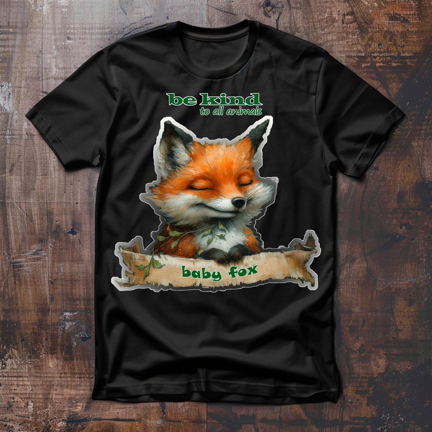 Kinder T-Shirt mit einem süßen kleinen Fuchs Oberkörper im Comic Stil gezeichnet, aufrecht mit den Vorderpfötchen über einer Banderole sitzend mit der Aufschrift baby fox. Slogan über dem Fuchskopf be kind to all animals.